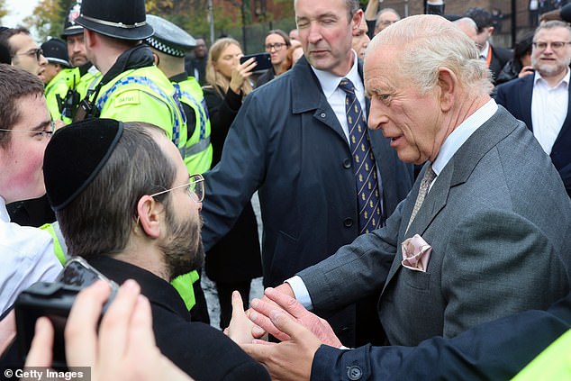 King Charles III meets people outside Heaton Park Hebrew Congregation Synagogue today