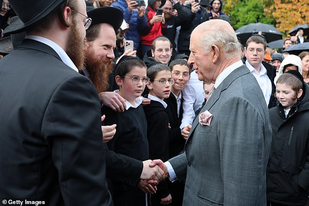 King Charles III meets people outside Heaton Park Hebrew Congregation Synagogue today