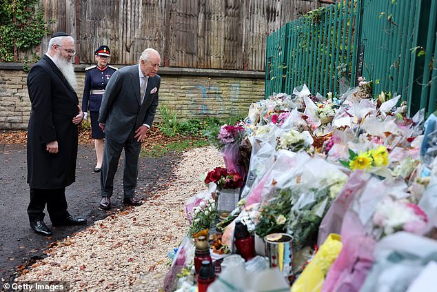 King Charles III views tributes on a visit to Heaton Park Hebrew Congregation Synagogue today