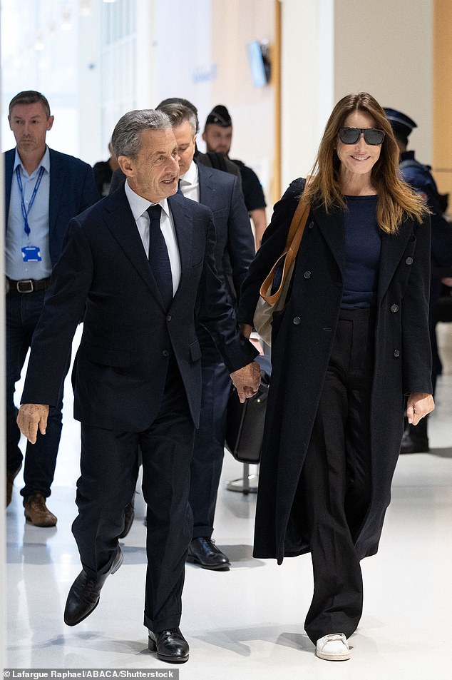 Bruni stood by her husband's side as a judge delivered the ruling. Her biographer wrote in The Times that she will visit him 'every day' in prison