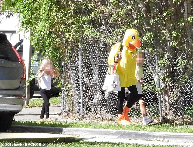 The tennis legend took children Nicholas, Mary and Lucy out in Miami Beach on Sunday