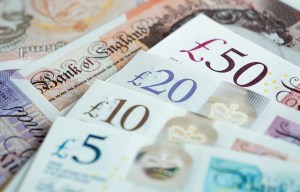 Close-up of British bank notes, including £5, £10, £20, and £50 denominations.