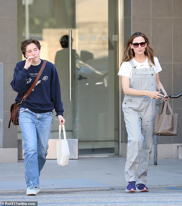 The outfit resembled a look their father wore in 2016 when he famously was spotted smoking a cigarette and sighing