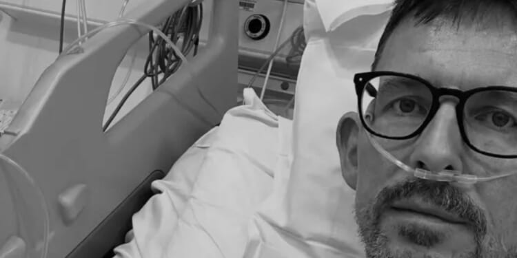 Radio show presenter suffers major heart attack and undergoes emergency surgery as he posts snap from hospital bed