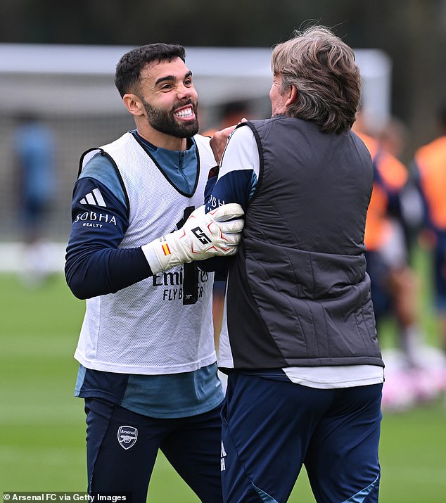 Heinze shares a joke with Arsenal keeper David Raya during training