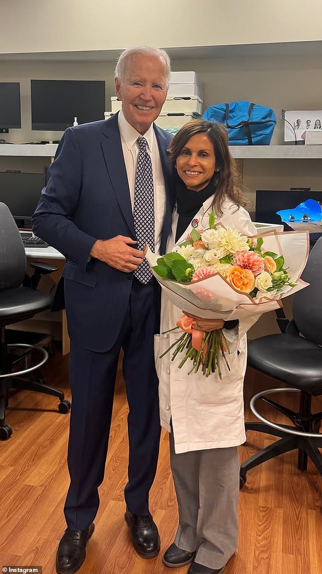Biden was pictured alongside his doctor, who had been gifted a bouquet of flowers after his treatment