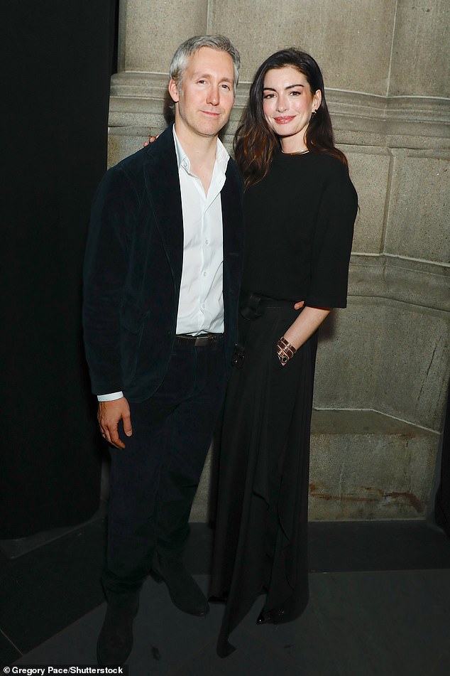 Meanwhile Adam opted for a white open-neck shirt with a dark green cord blazer and matching trousers, with a pair of suede boots