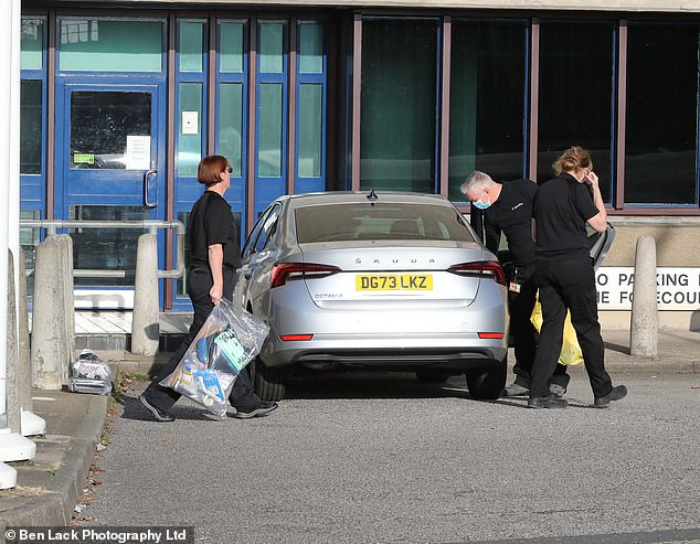 Forensic officers are pictured outside HMP Wakefield following Watkins's death