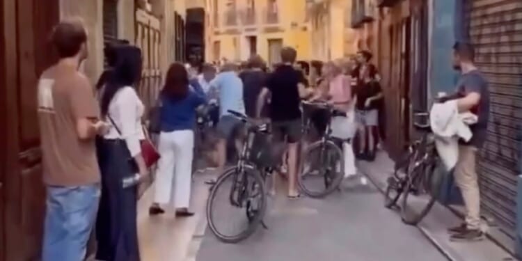 Spanish anti-tourist yobs scream ‘go home’ in dramatic clash with cycling holidaymakers… who reply with 'f**k you' chant