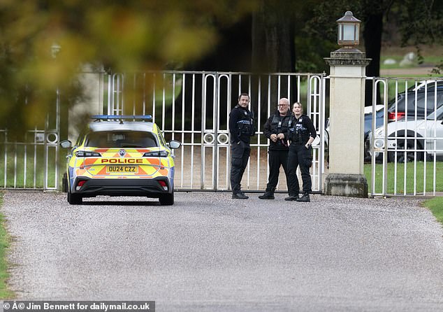 Police were seen guarding the gates of Andrew and Fergie's home today
