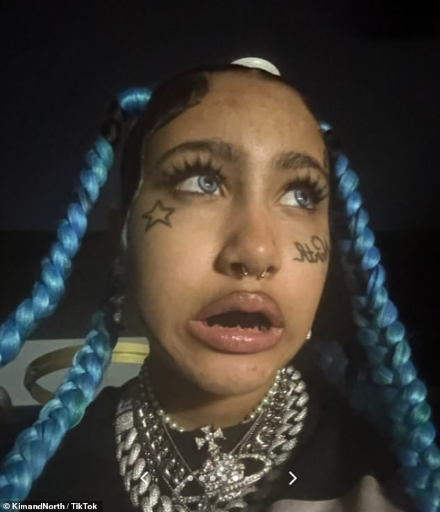 She rocked long, blue braids and fake blue contacts, as well as black grillz and a faux nose ring