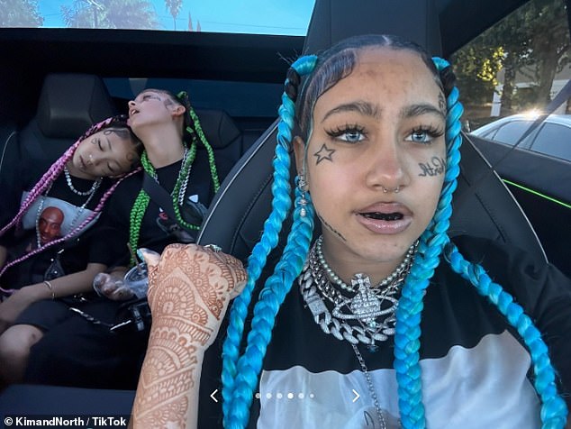 Most notable was the massive fake ink designs on her face, which included a star below her eye and a word in script on her cheek