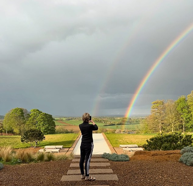 The Ally McBeal actress was seen in a sweater, sweatpants and slides in the backyard