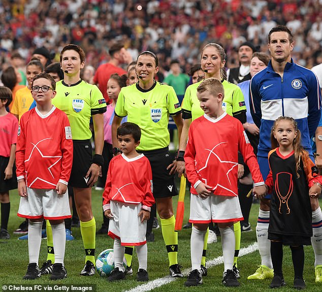 Boasting an impressive CV, she became the first Italian to referee a Women's World Cup final and was an assistant during Liverpool 's Super Cup win over Chelsea in 2019 (second right)