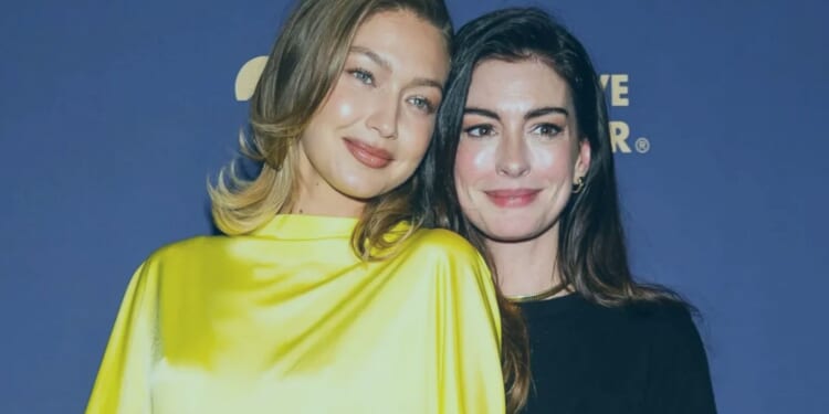 Gigi Hadid looks sensational in bright yellow gown as she hugs pal Anne Hathaway on red carpet in New York