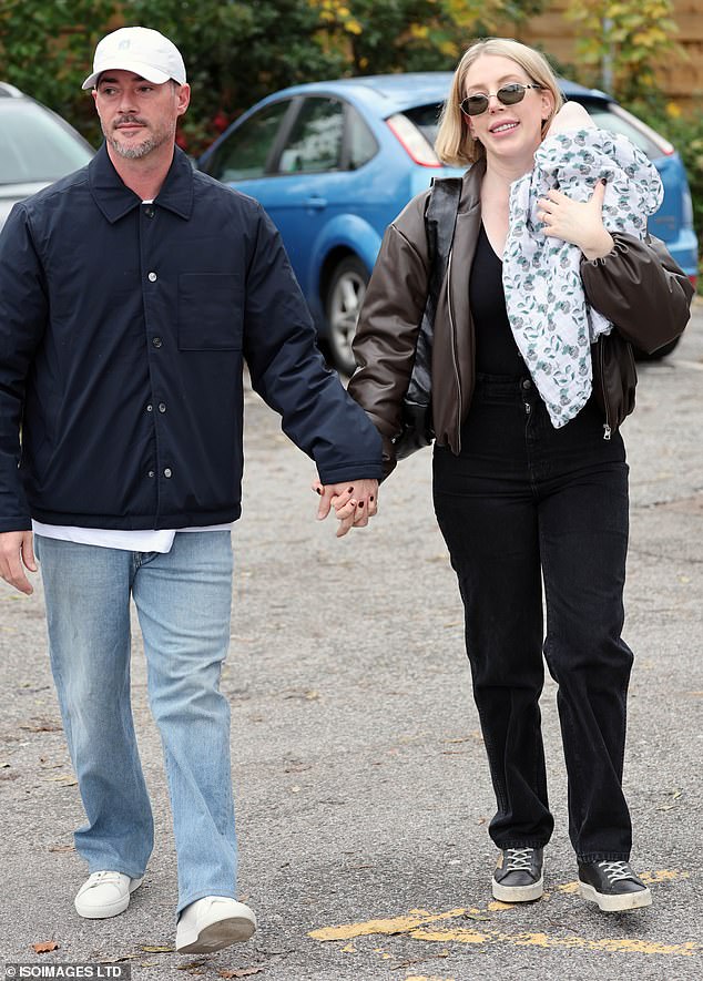 Katherine offered a warm smile as she walked hand-in-hand with Bobby