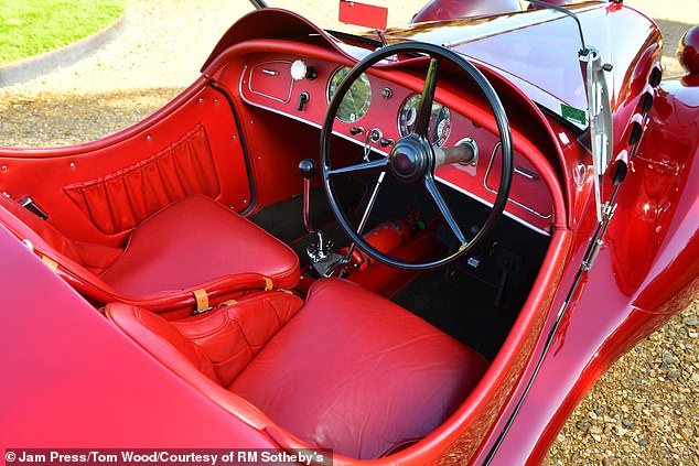 The Alfa Romeo's red exterior is complimented by its leather interior of the same colour