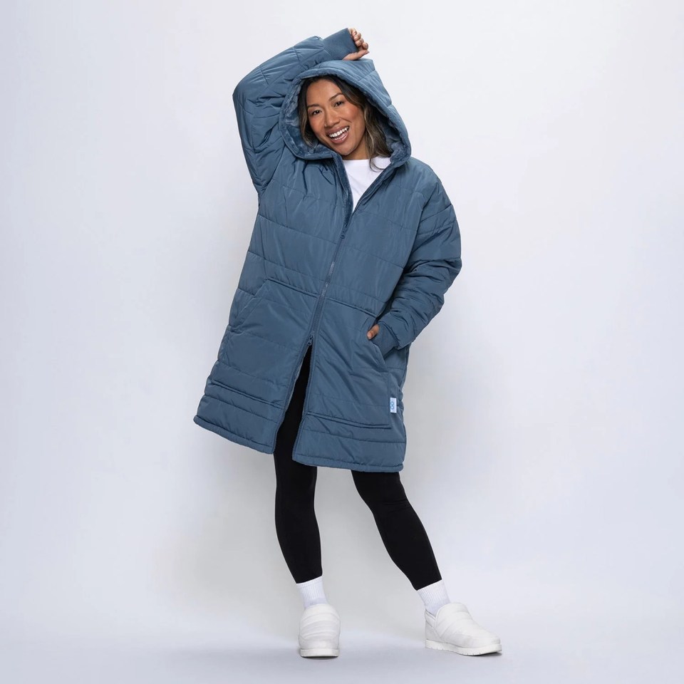 A woman wearing a steel blue outdoor oodie.