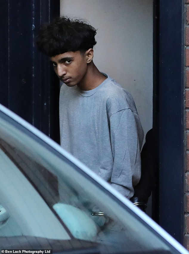 Khan pictured in handcuffs outside court. He was sentenced today at Sheffield Crown Court