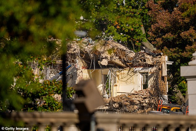 The facade of the East Wing of the White House is demolished by work crews on Wednesday