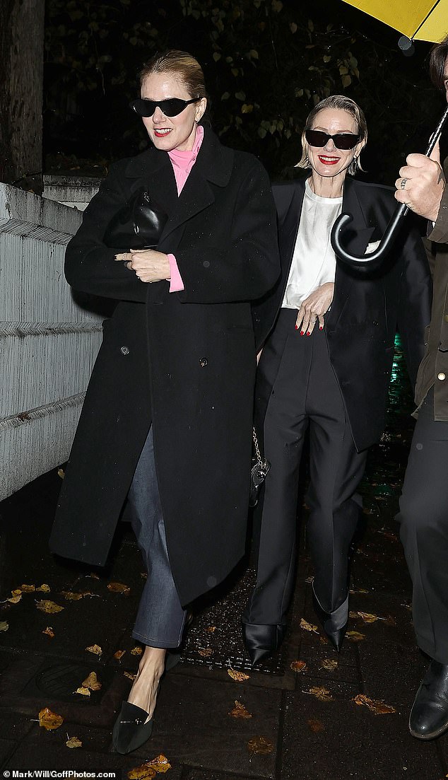 Naomi added dark shades to her look