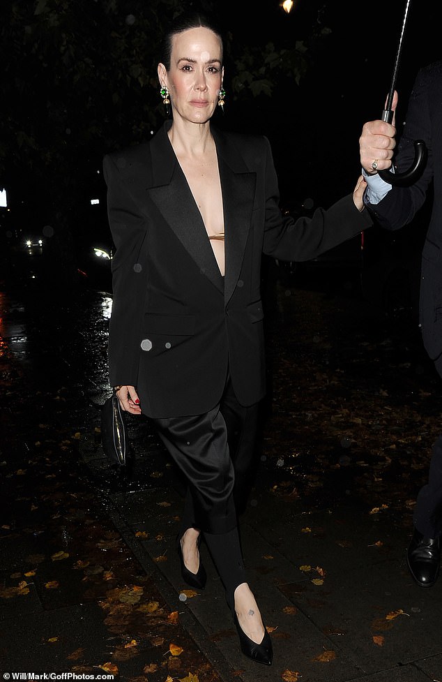 And accessorised with green and silver earrings