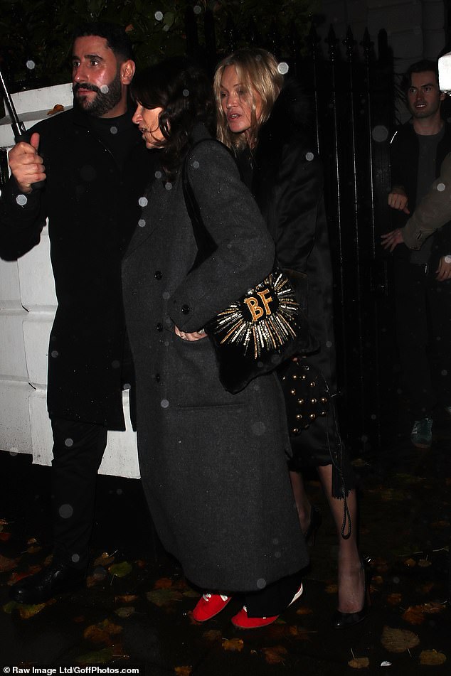 Showcasing her model legs, the quinquagenarian wore an eye-wateringly short mini with sky-high cort shoes and a chic fur-collared black coat