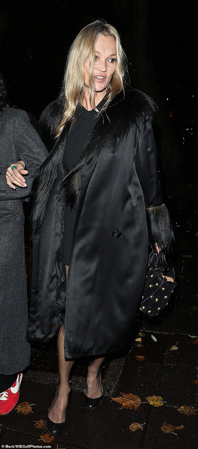 Her silk coat perfectly complemented her LBD