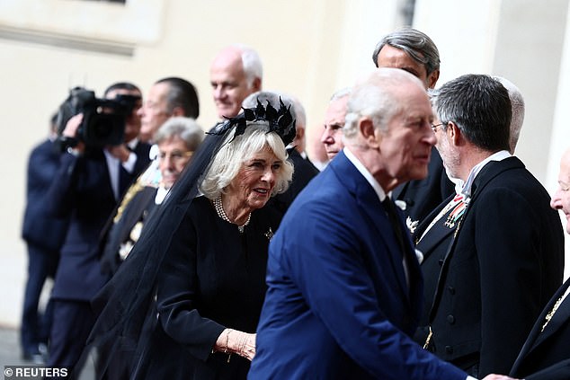 King Charles III and Queen Camilla are welcomed by officials at San Damaso Courtyard today