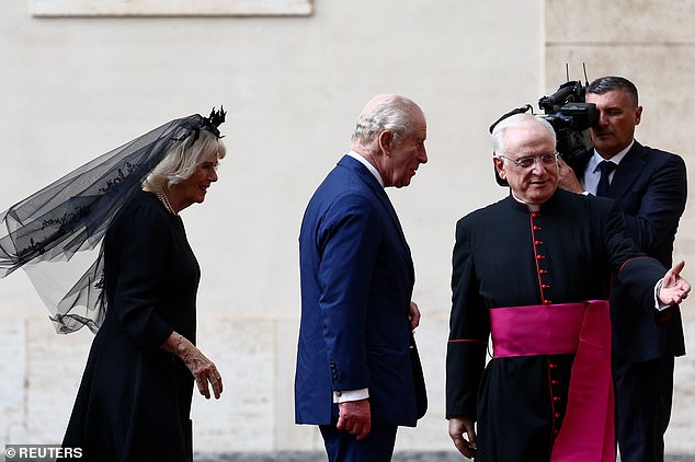King Charles III and Queen Camilla are welcomed by officials at San Damaso Courtyard today