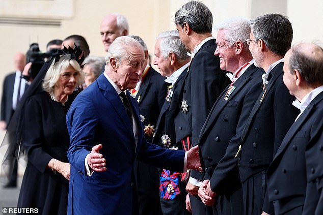 King Charles III and Queen Camilla are welcomed by officials at San Damaso Courtyard today