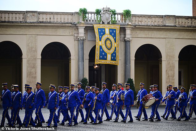 The Band of the Gendarmerie Corps of Vatican City prepare for the King and Queen's visit