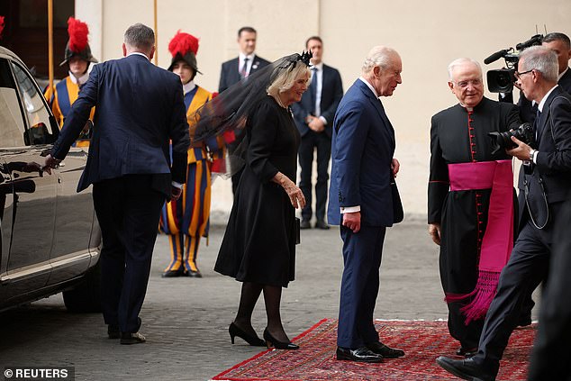 King Charles III and Queen Camilla are welcomed by officials at San Damaso Courtyard today