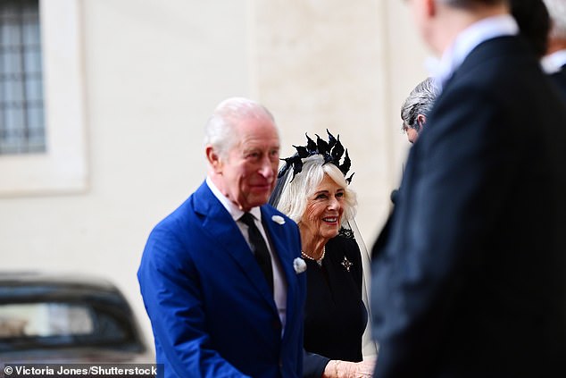 King Charles III and Queen Camilla are welcomed by officials at San Damaso Courtyard today