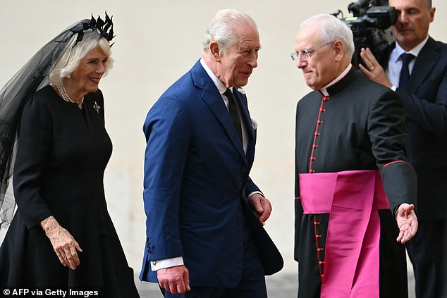 King Charles III and Queen Camilla are welcomed by officials at San Damaso Courtyard today