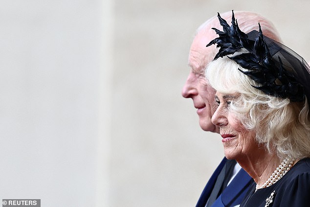 King Charles III and Queen Camilla are welcomed by officials at San Damaso Courtyard today