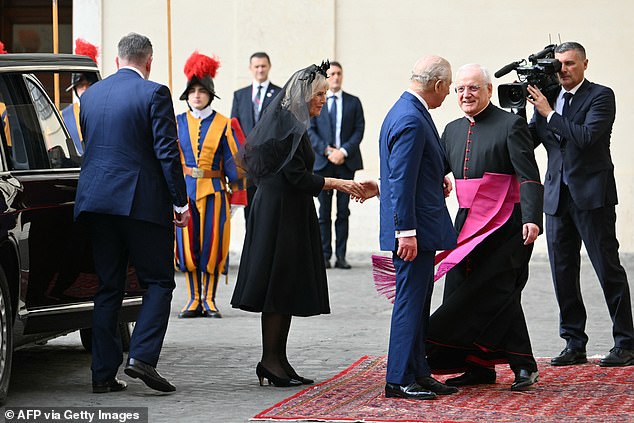 King Charles III and Queen Camilla are welcomed by officials at San Damaso Courtyard today