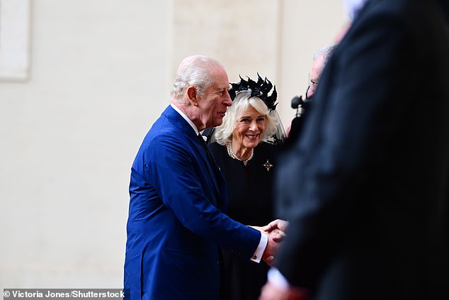 King Charles III and Queen Camilla are welcomed by officials at San Damaso Courtyard today