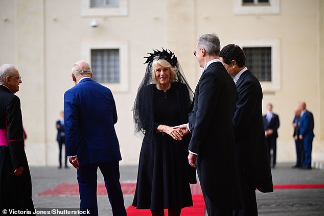 King Charles III and Queen Camilla are welcomed by officials at San Damaso Courtyard today