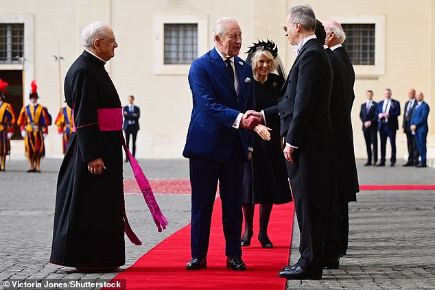 King Charles III and Queen Camilla are welcomed by officials at San Damaso Courtyard today