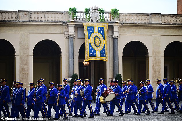 The Band of the Gendarmerie Corps of Vatican City prepare for the King and Queen's visit