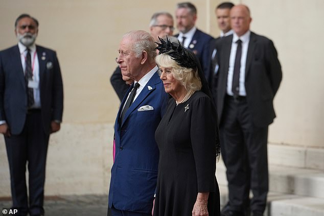 King Charles III and Queen Camilla are welcomed by officials at San Damaso Courtyard today