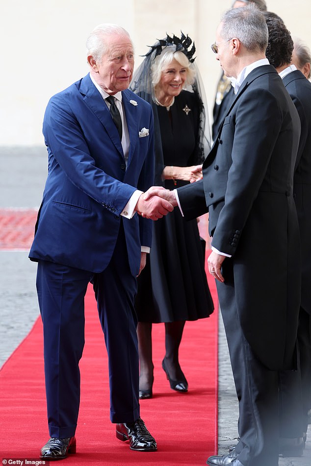 King Charles III and Queen Camilla are welcomed by officials at San Damaso Courtyard today