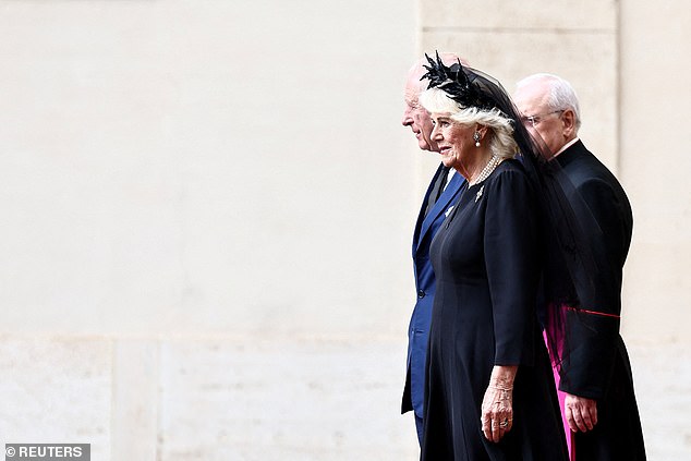 King Charles III and Queen Camilla are welcomed by officials at San Damaso Courtyard today