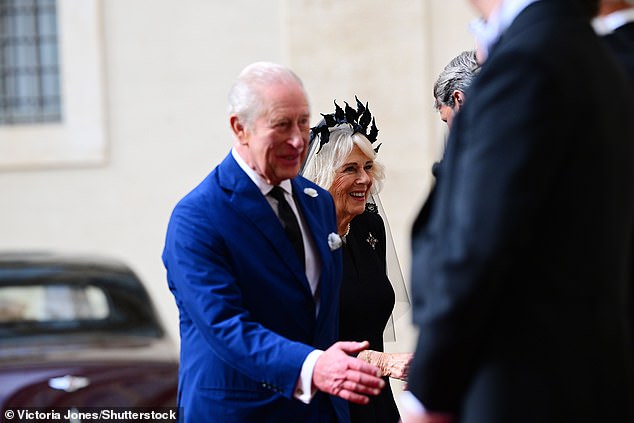 King Charles III and Queen Camilla are welcomed by officials at San Damaso Courtyard today