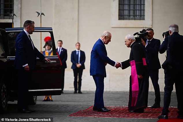 King Charles III and Queen Camilla are welcomed by officials at San Damaso Courtyard today