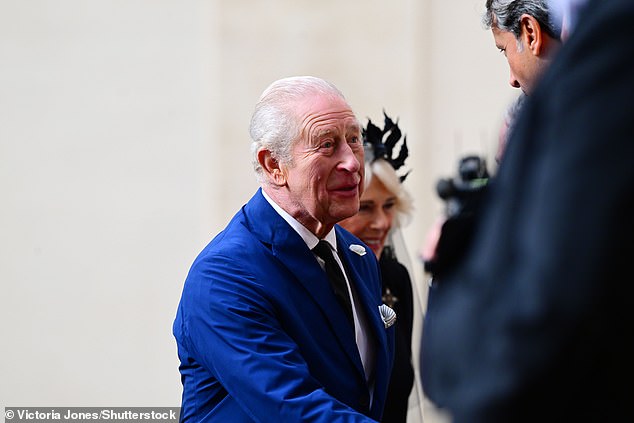 King Charles III and Queen Camilla are welcomed by officials at San Damaso Courtyard today