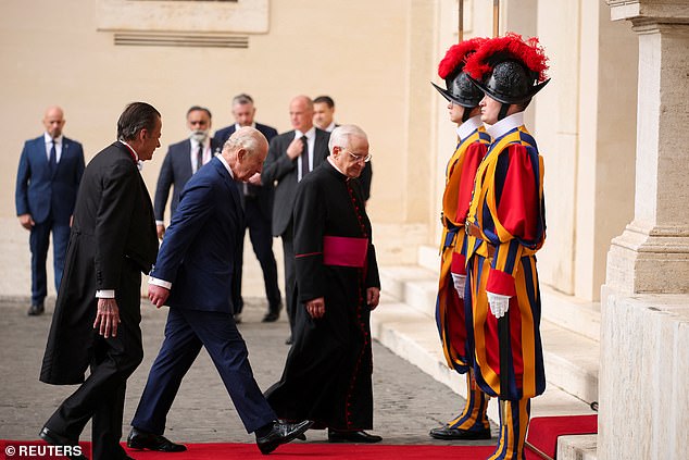King Charles III and Queen Camilla are welcomed by officials at San Damaso Courtyard today