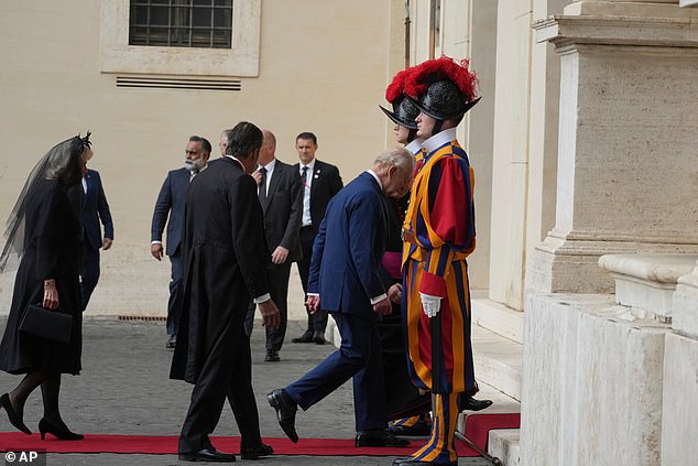 King Charles III and Queen Camilla are welcomed by officials at San Damaso Courtyard today