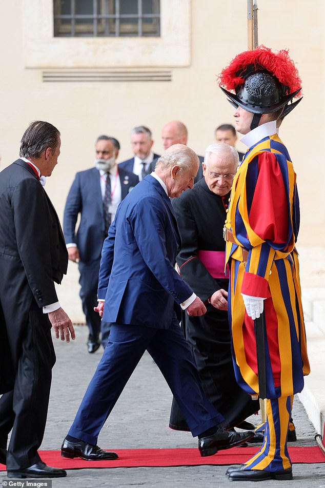 King Charles III and Queen Camilla are welcomed by officials at San Damaso Courtyard today